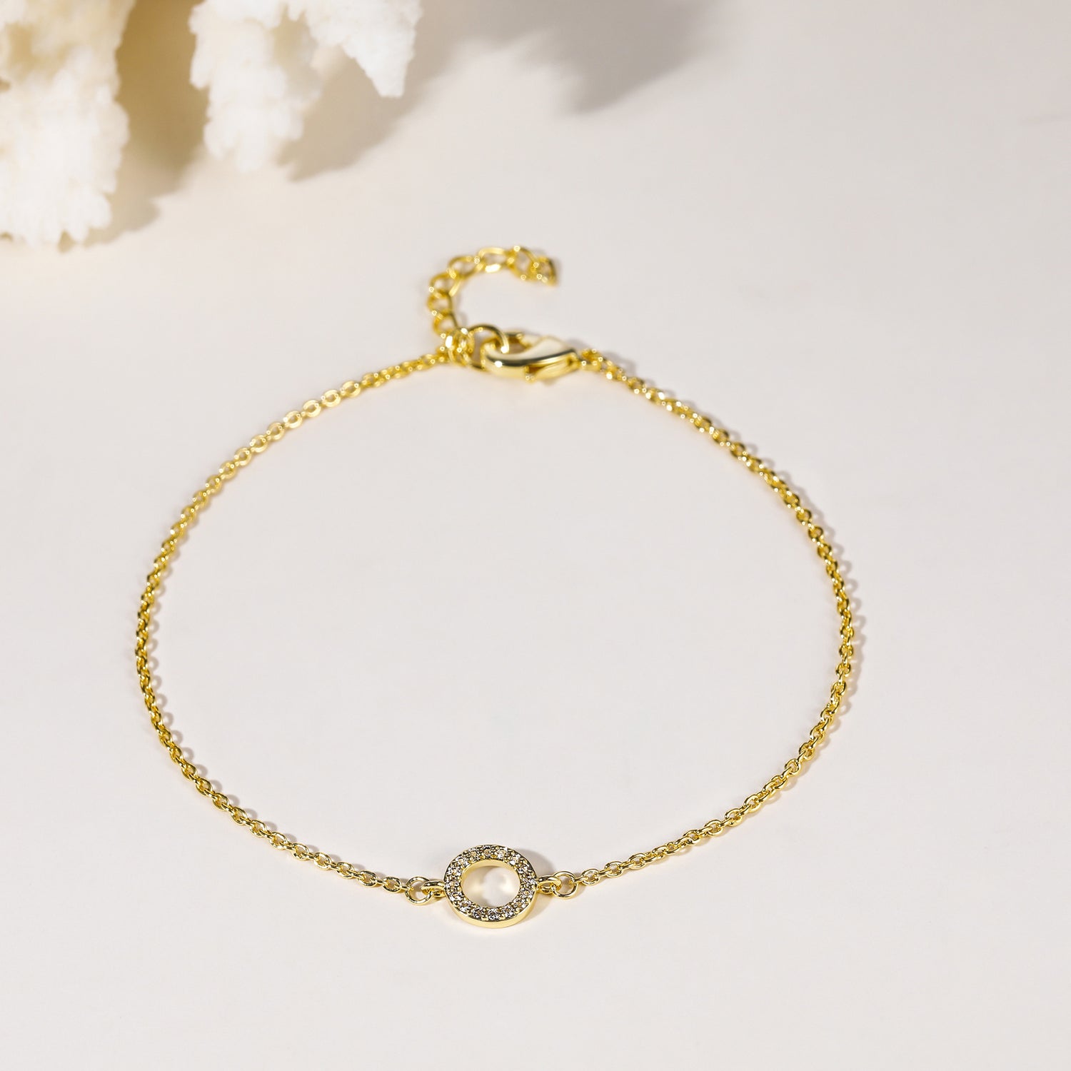 Bracciale in oro con pietre preziose circolari